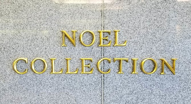 Noel Collection sign